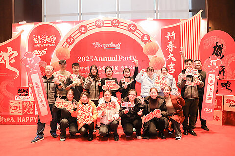 Group picture of Coroplast employees in China wishing Happy New Year in different languages