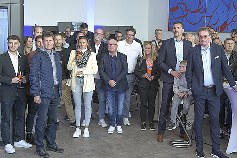 Guests at the new TAPE HUB listened closely as the evening’s moderator took the stage.