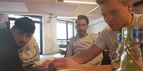 Pitch team with three apprentices at work on the laptop