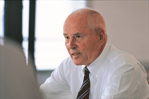 Dr. Kurt Mueller Mann at his desk
