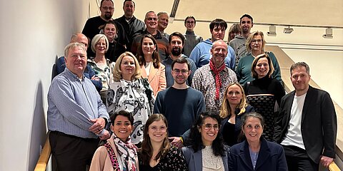 Participants of the Coroplast Group art tours in the staircase of the museum