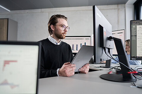 Coroplast Group student working on thesis in front of computer