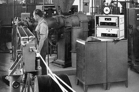 Woman working on a production machine