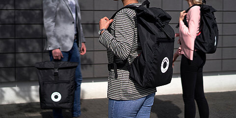 Photo of Coroplast Group employees with an upcycling backpack