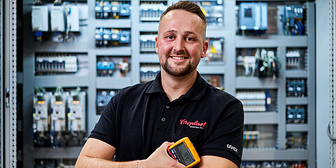 Instructor Arne Sonnenschein stands in front of a control panel.