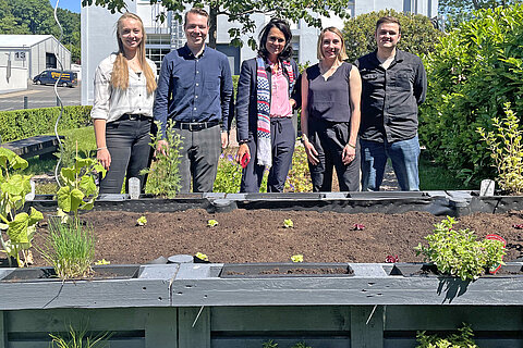 Group picture of the third-placed team of the trainee pitch with their vegetable patch