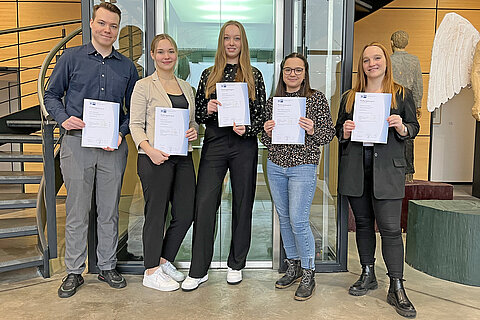 Five Coroplast Group apprentices with their final certificate 