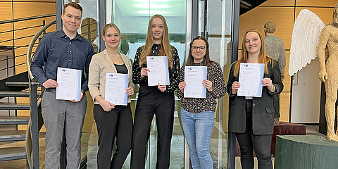 Five Coroplast Group apprentices with their final certificate 