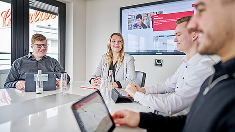 Instructor talking to three apprentices